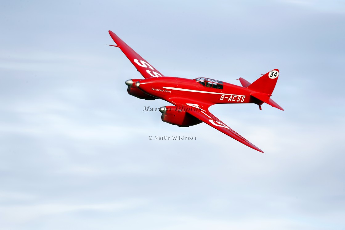 "De Havilland Comet Racer G-ACSS in flight" stock image