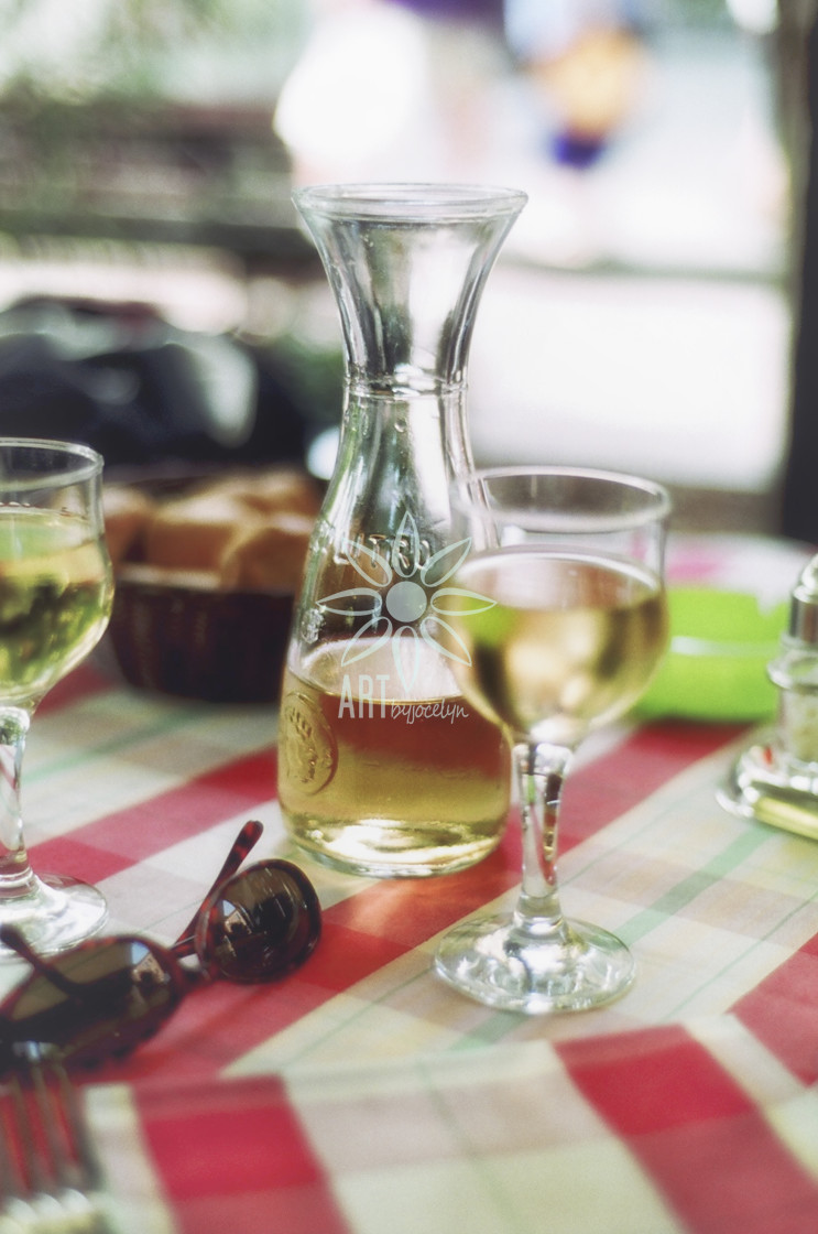 "White Wine and Sunglasses on Table in Restaurant" by Jocelyn Ball - $6.32 "White Wine and Sunglasses on Table in Restaurant" stock image