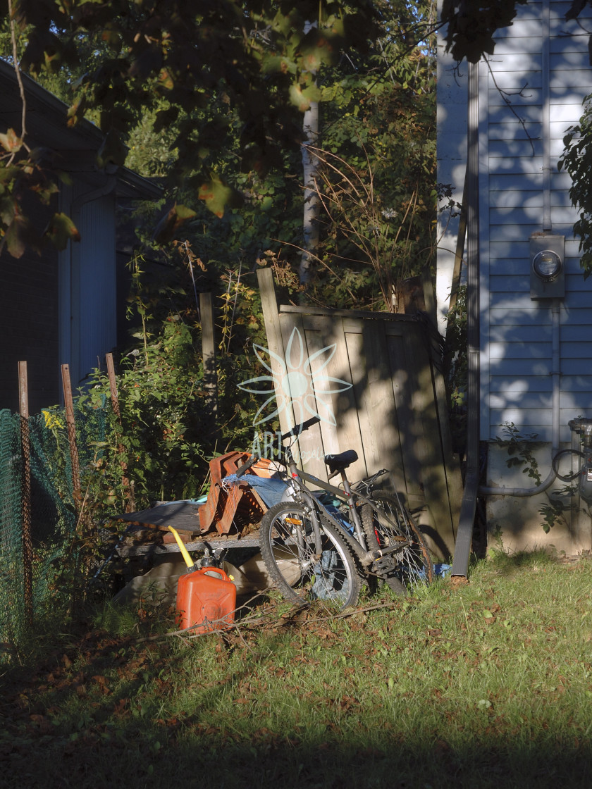 "Old Bike and Junk in Yard" stock image