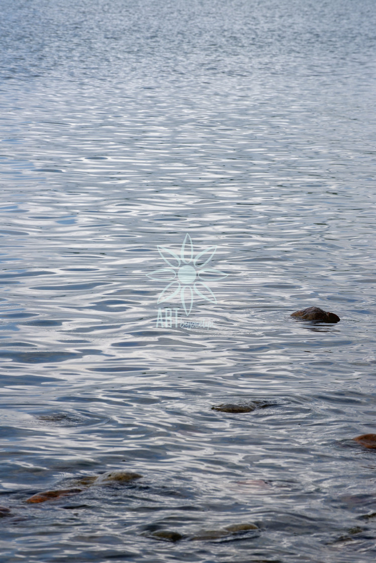 "Serene Tips of Rocks and Rippled Water" stock image