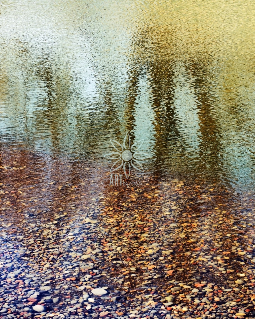 "Rippled Water Reflections and Coloured Stones" stock image