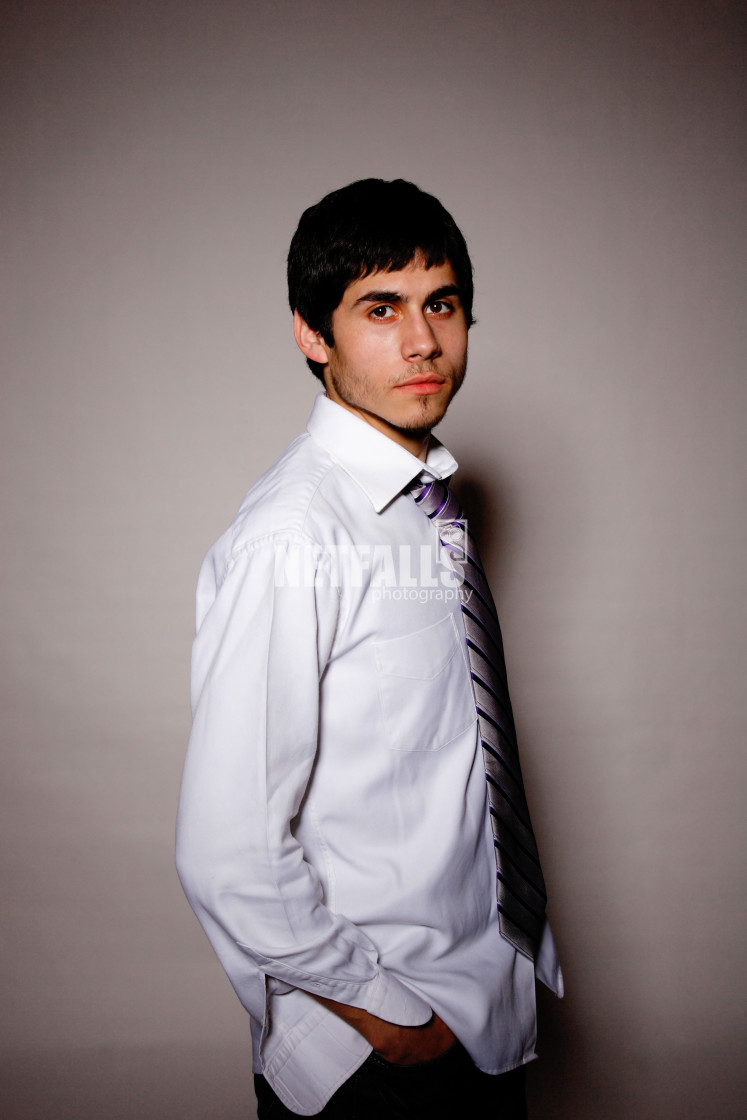 "Businessman putting on tie" stock image