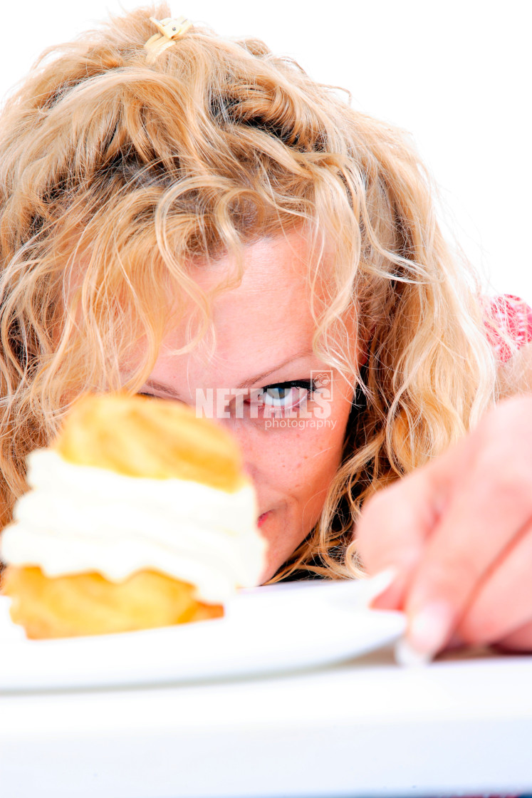 "Woman eating cake" stock image