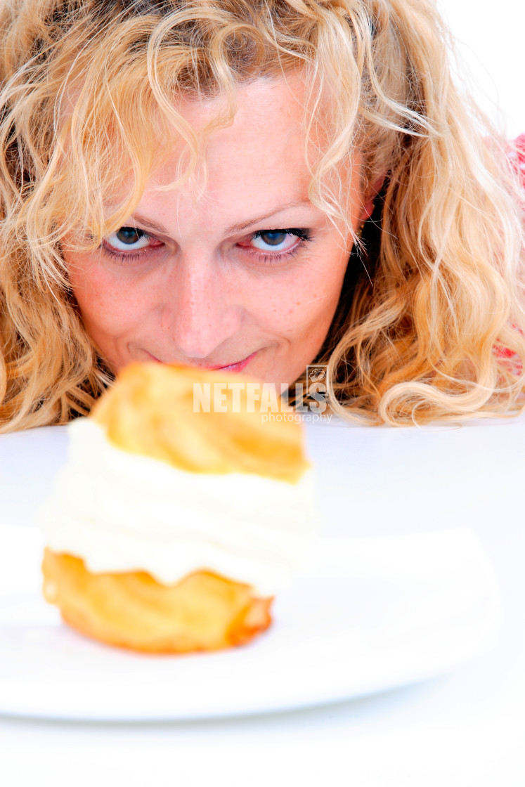 "Woman eating cake" stock image