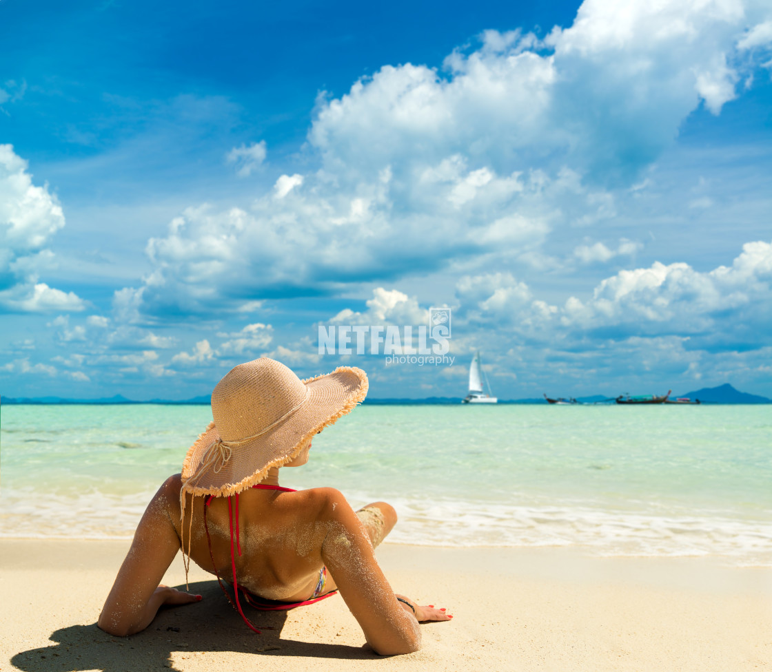 "Woman with a straw hat at the beach in Koh Poda island Thailand" stock image