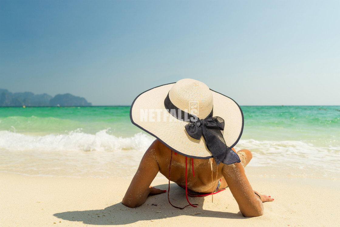 "Woman with a straw hat at the beach in Koh Poda island Thailand" stock image