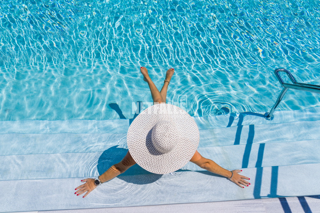 "woman in luxury spa resort near the swimming pool." stock image