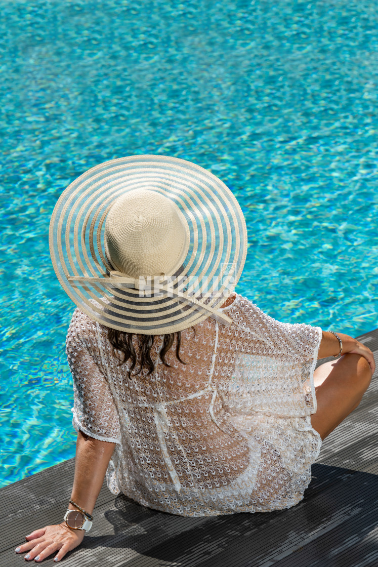 "woman in luxury spa resort near the swimming pool." stock image