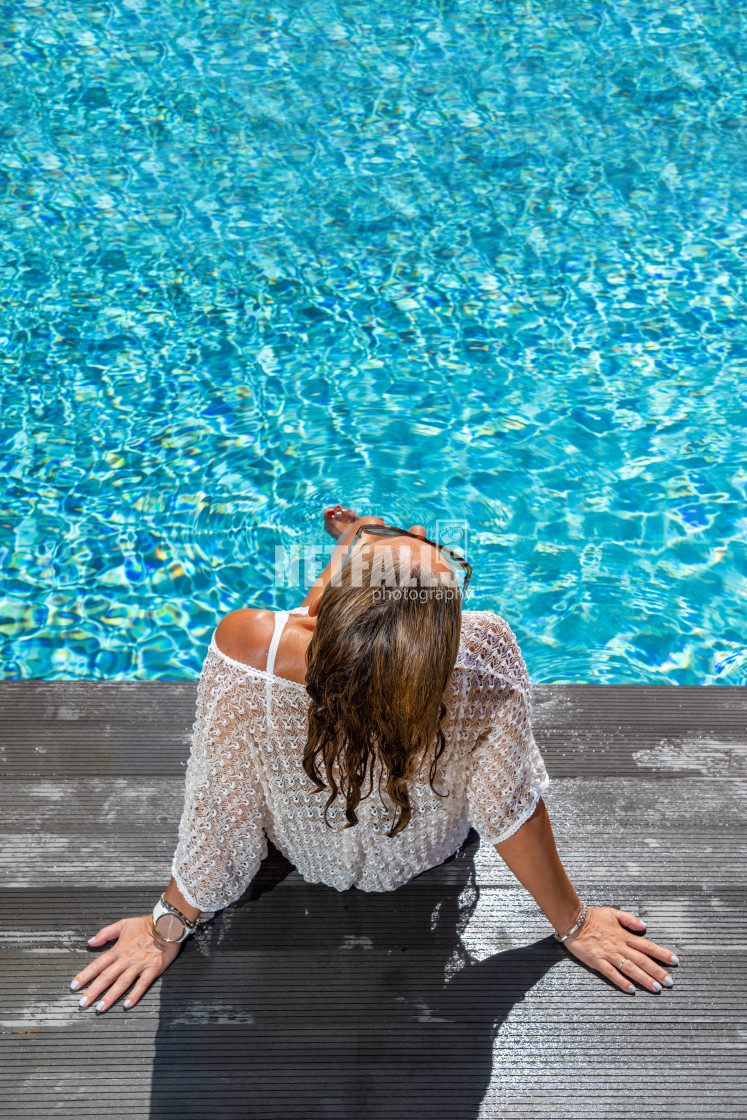 "woman in luxury spa resort near the swimming pool." stock image