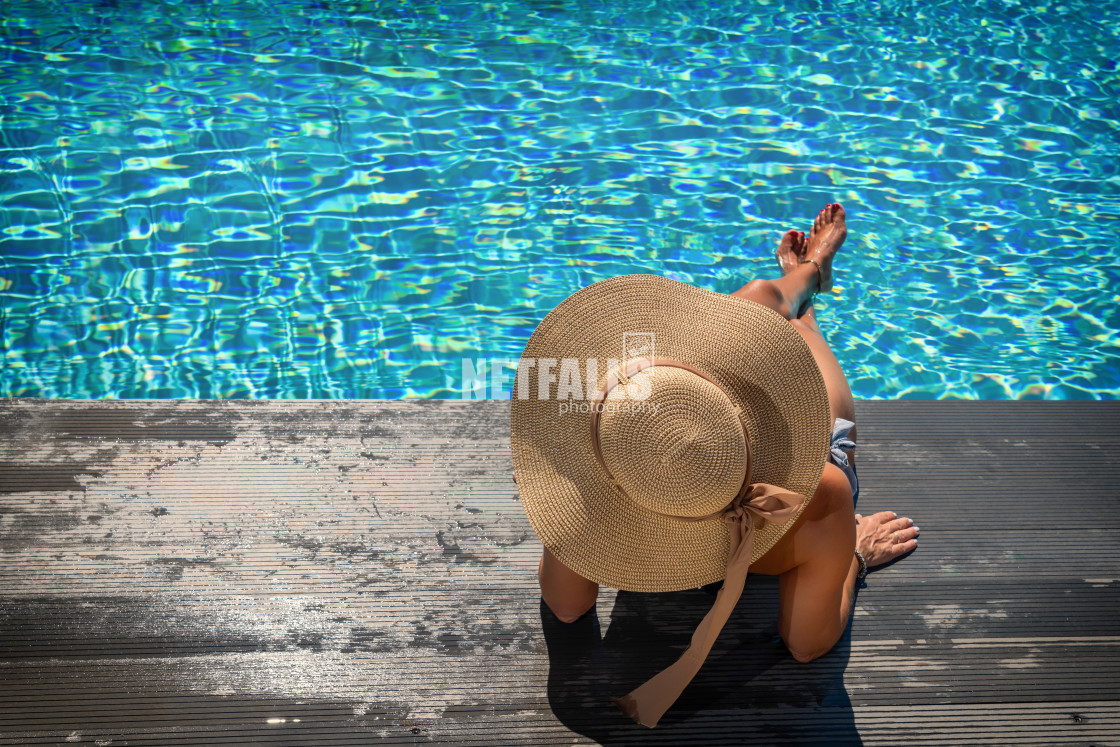 "Woman on the deck at the swimming pool" stock image