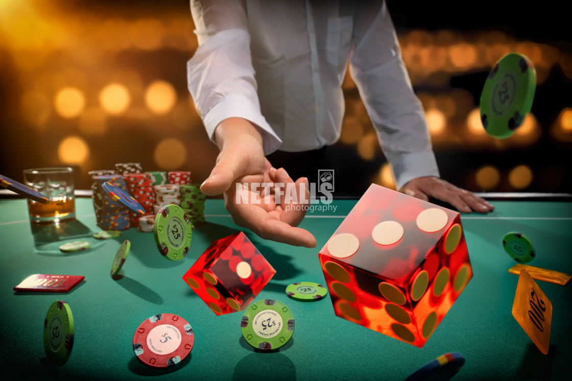 "Man gambling at the craps table" stock image