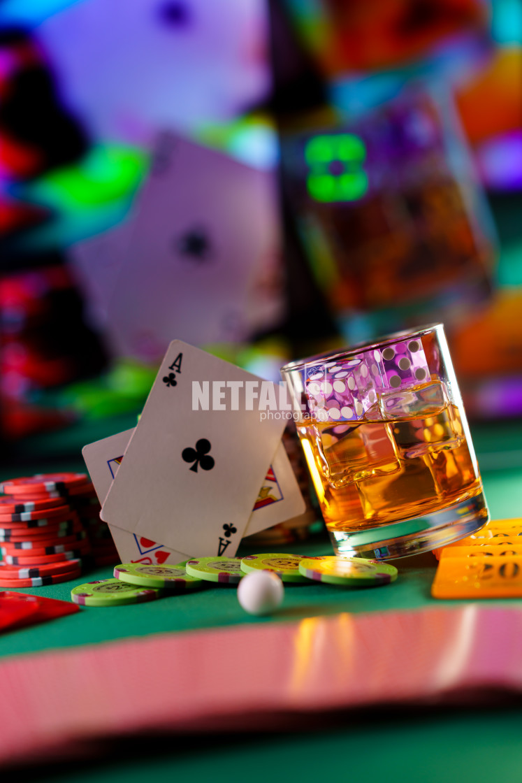 "cocktail glass on the casino gambling table" stock image