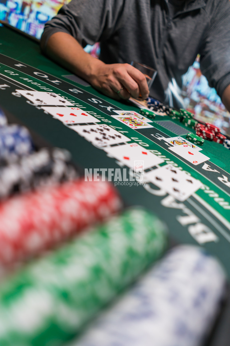 "Man playing BlackJack at the casino" stock image