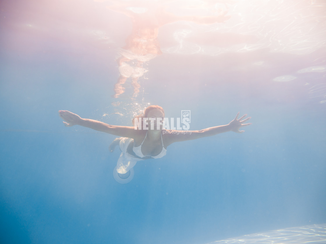 "Woman underwater at the pool" stock image