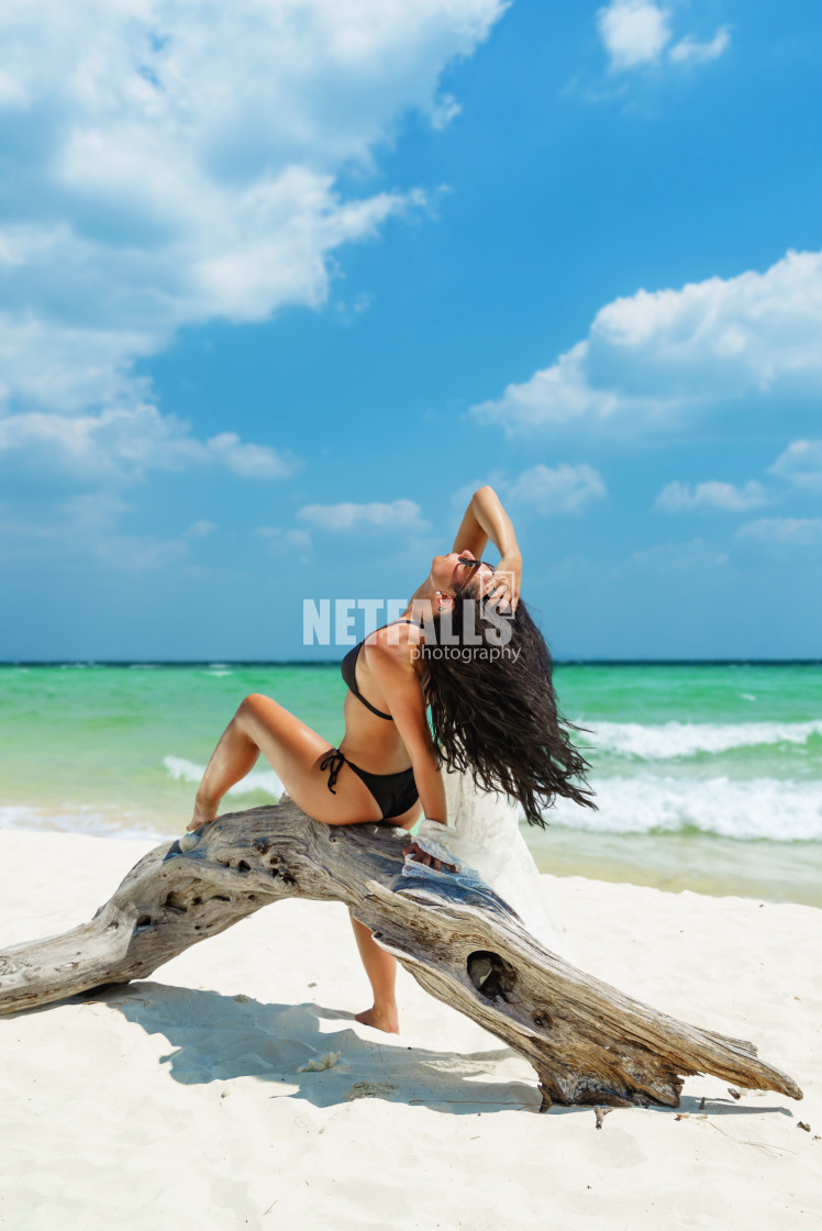 "Young woman on the white sand beach" stock image