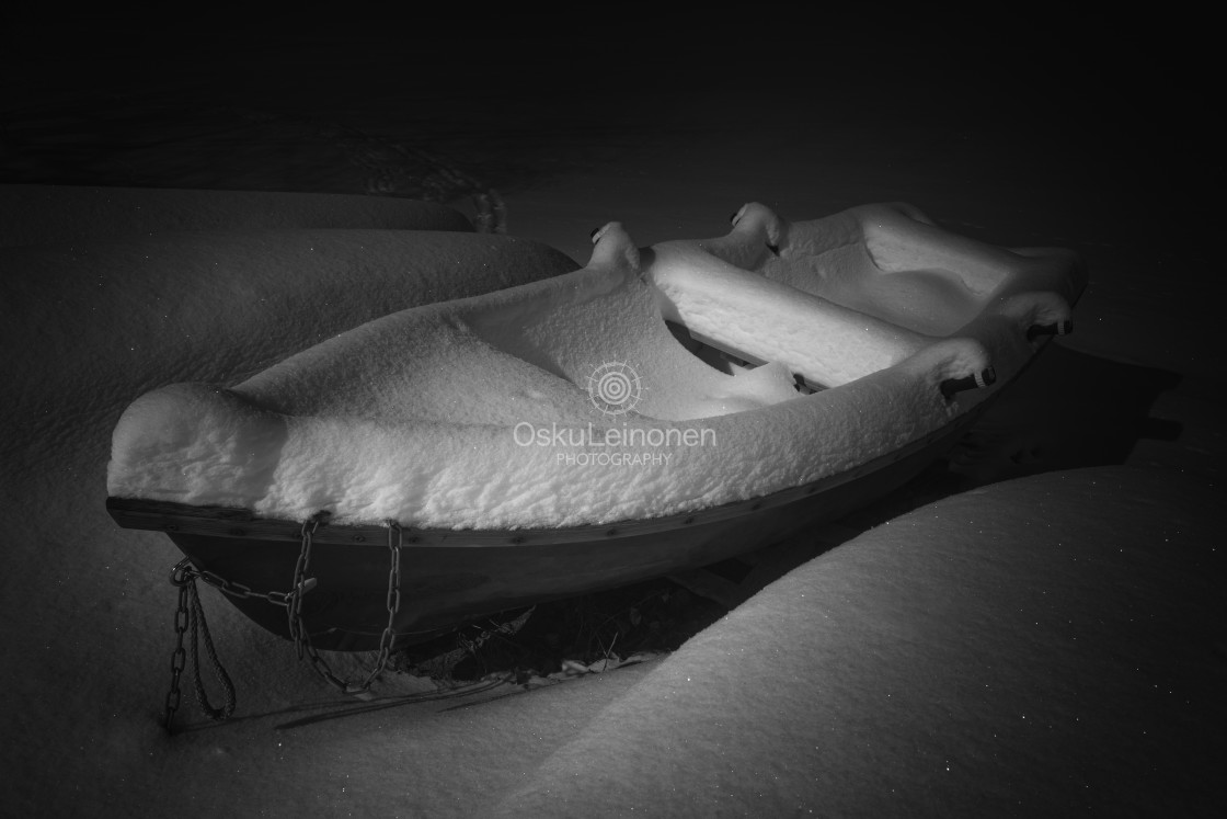 "Hidden Under II (Snow And Boat)" stock image