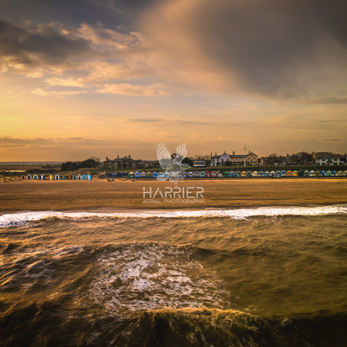 "Southwold Beach Huts under Stormy Skies" stock image