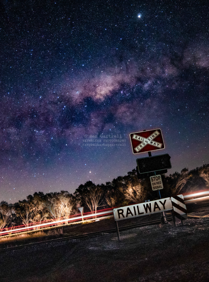 "milky way over railway signs" stock image