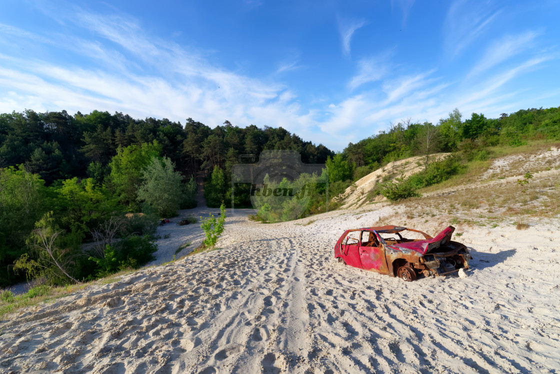 "Old wreck car and sand dunes" stock image