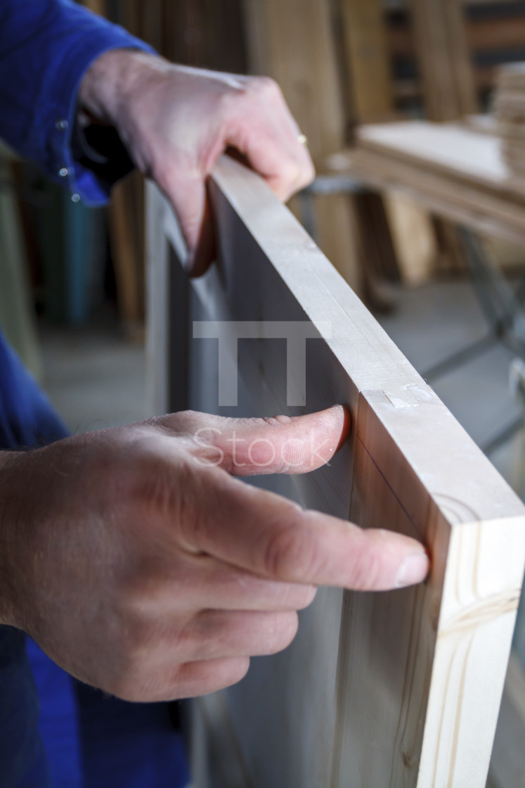 "Carpenter at work measuring" by TTStock - £14.99 "Carpenter at work measuring" stock image