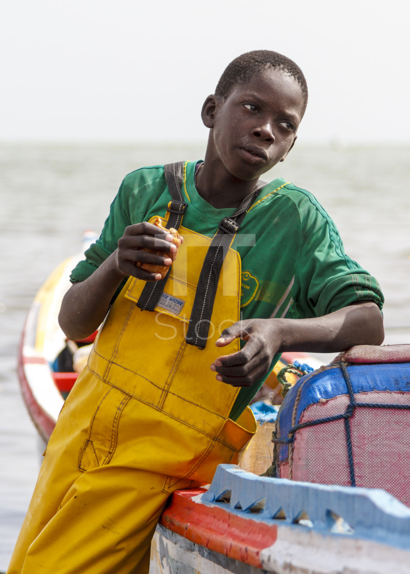 "Young fisherman eating snack" by TTStock - $7.46 "Young fisherman eating snack" stock image