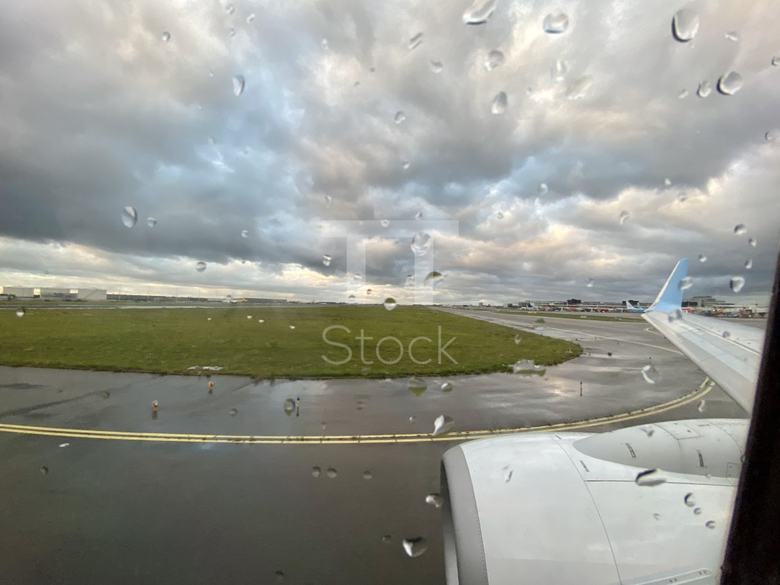 "Taxiing at Schiphol airport on a bad weather rainy day." by TTStock - $7.46 "Taxiing at Schiphol airport on a bad weather rainy day." stock image