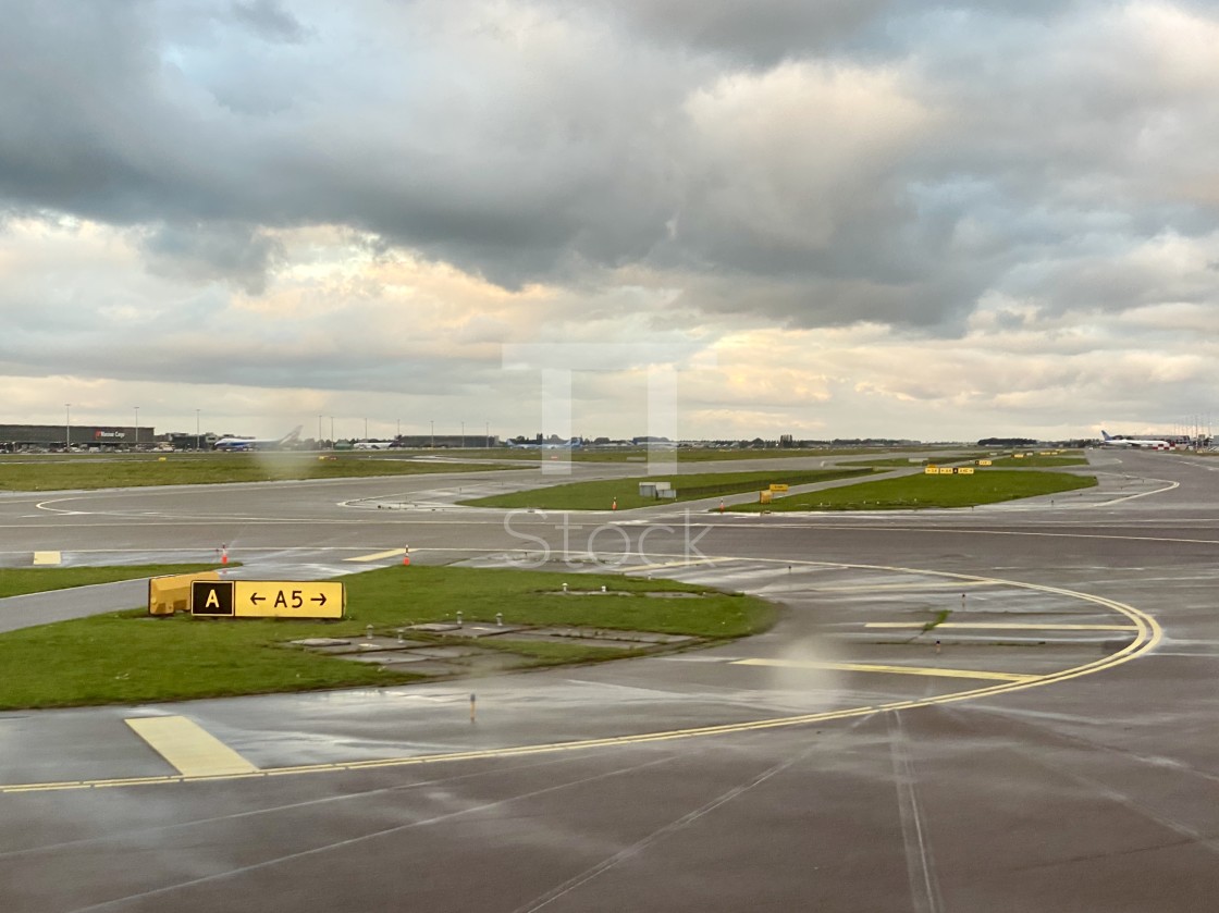 "Taxiing at Schiphol airport on a bad weather rainy day." by TTStock - $7.54 "Taxiing at Schiphol airport on a bad weather rainy day." stock image