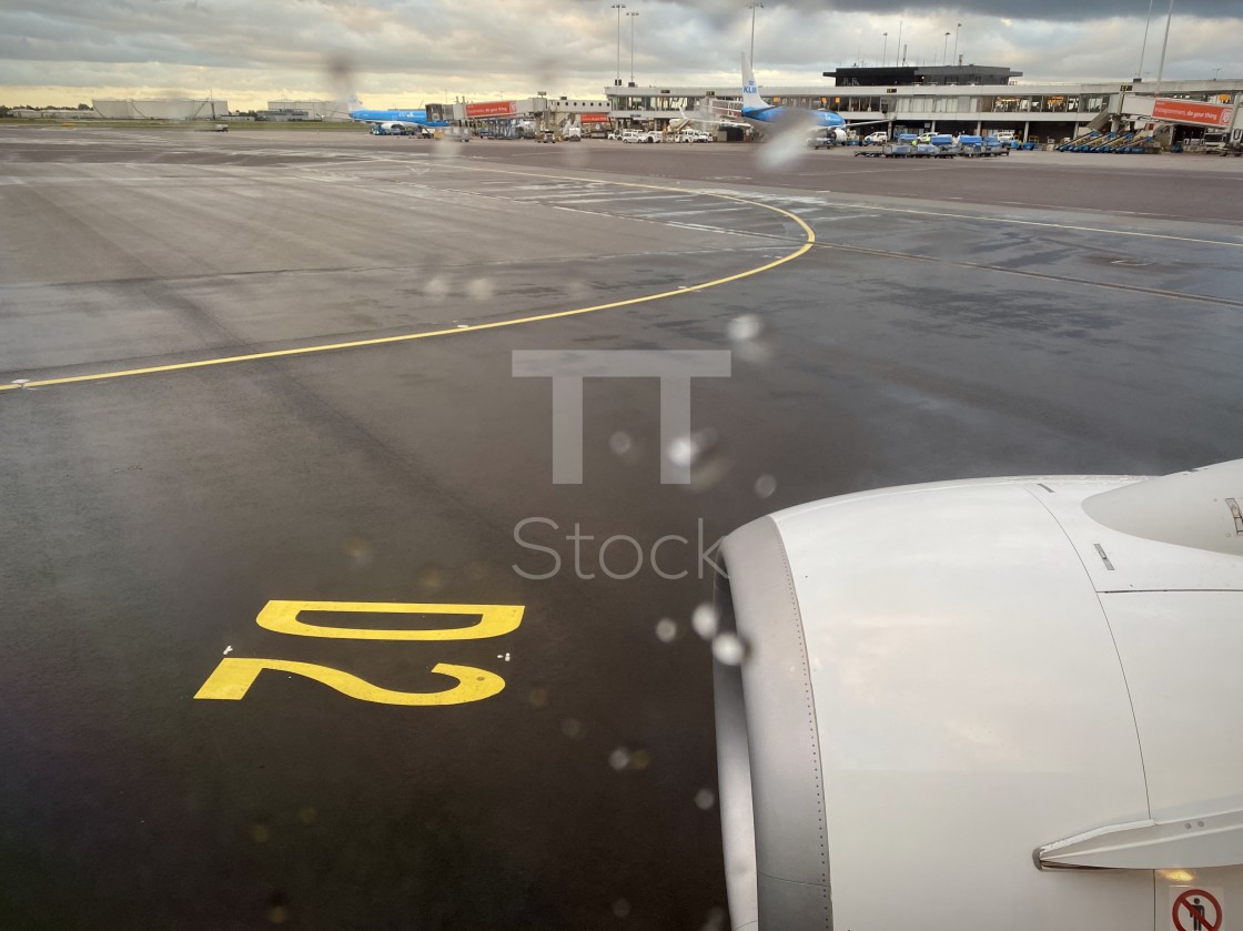 "Taxiing at Schiphol airport on a bad weather rainy day." by TTStock - $7.54 "Taxiing at Schiphol airport on a bad weather rainy day." stock image