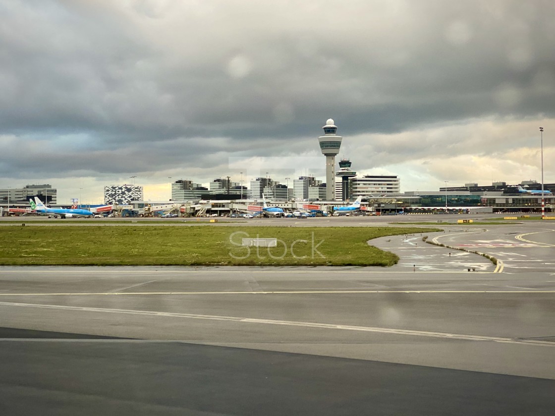 "Looking out aircraft window to Schiphol airport." by TTStock - $7.46 "Looking out aircraft window to Schiphol airport." stock image