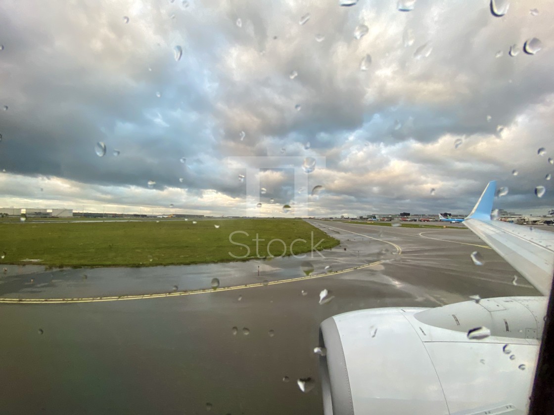 "Looking out aircraft window on runway tarmac." by TTStock - $7.54 "Looking out aircraft window on runway tarmac." stock image