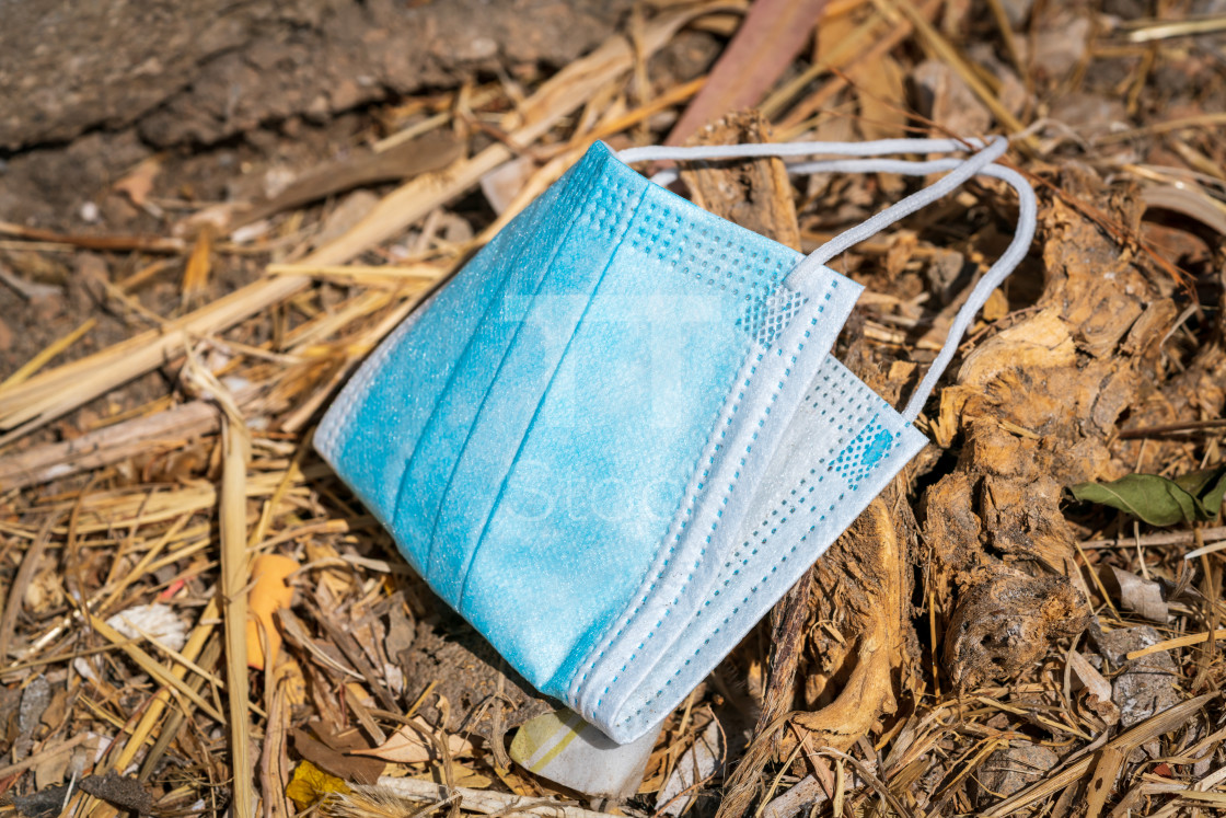"Discarded blue disposable face covering 2" by TTStock - £14.99 "Discarded blue disposable face covering 2" stock image