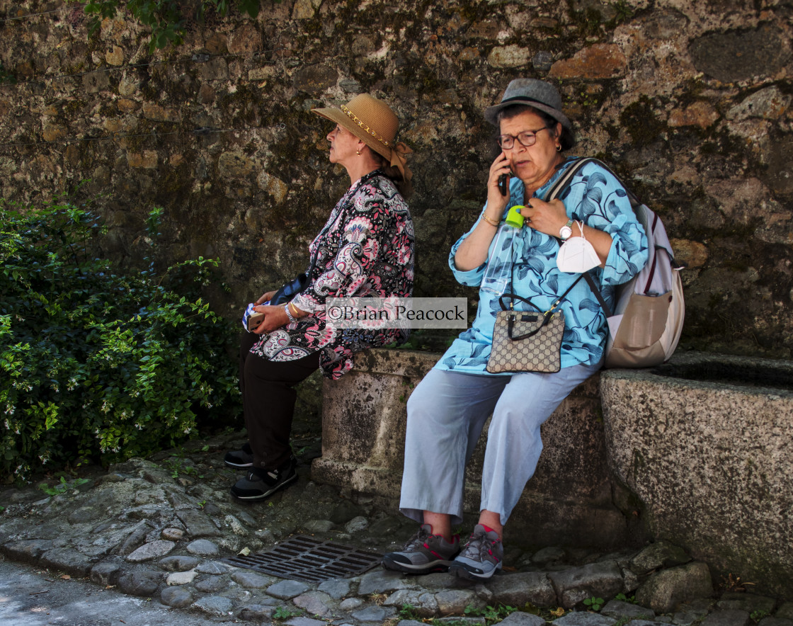 "Two colourful ladies resting" stock image