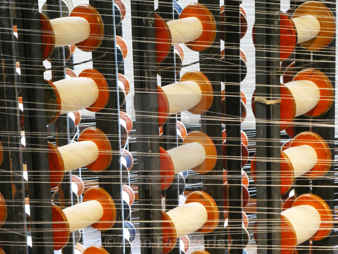 "Cotton bobbins on a textile loom" stock image