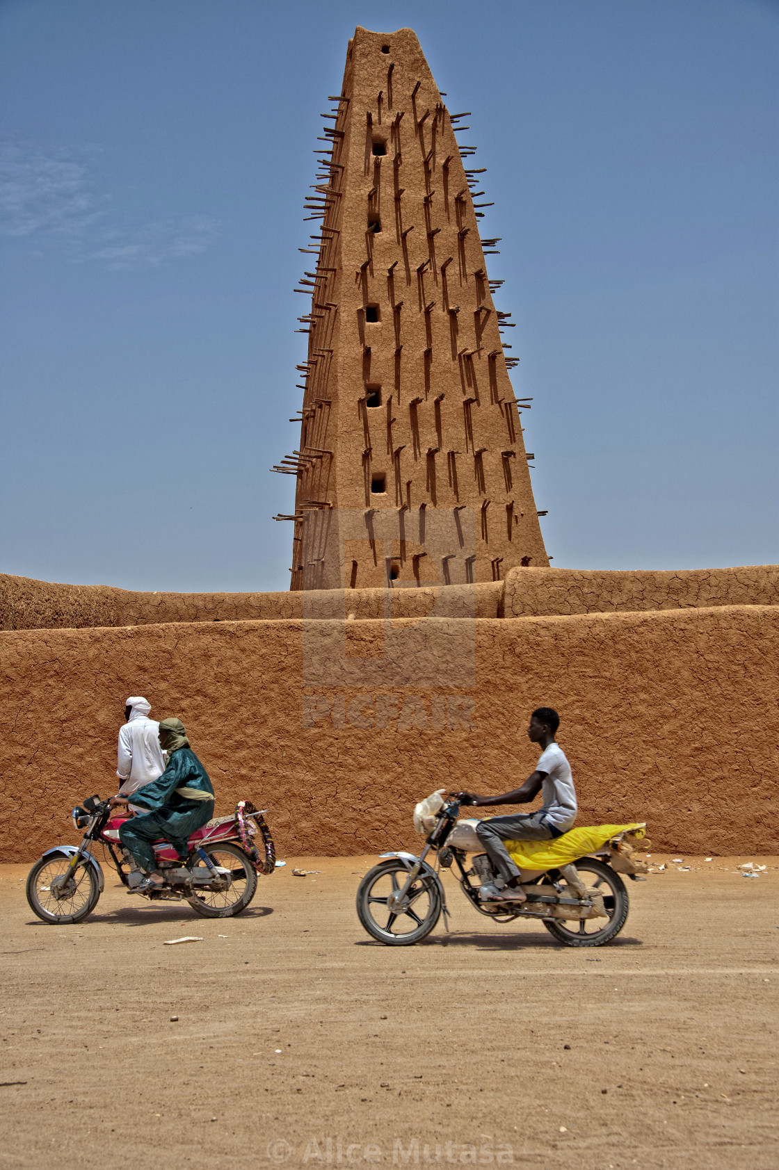 "Agadez mosque with motorbikes; Niger" by Alice Mutasa - $50.22 "Agadez mosque with motorbikes; Niger" stock image