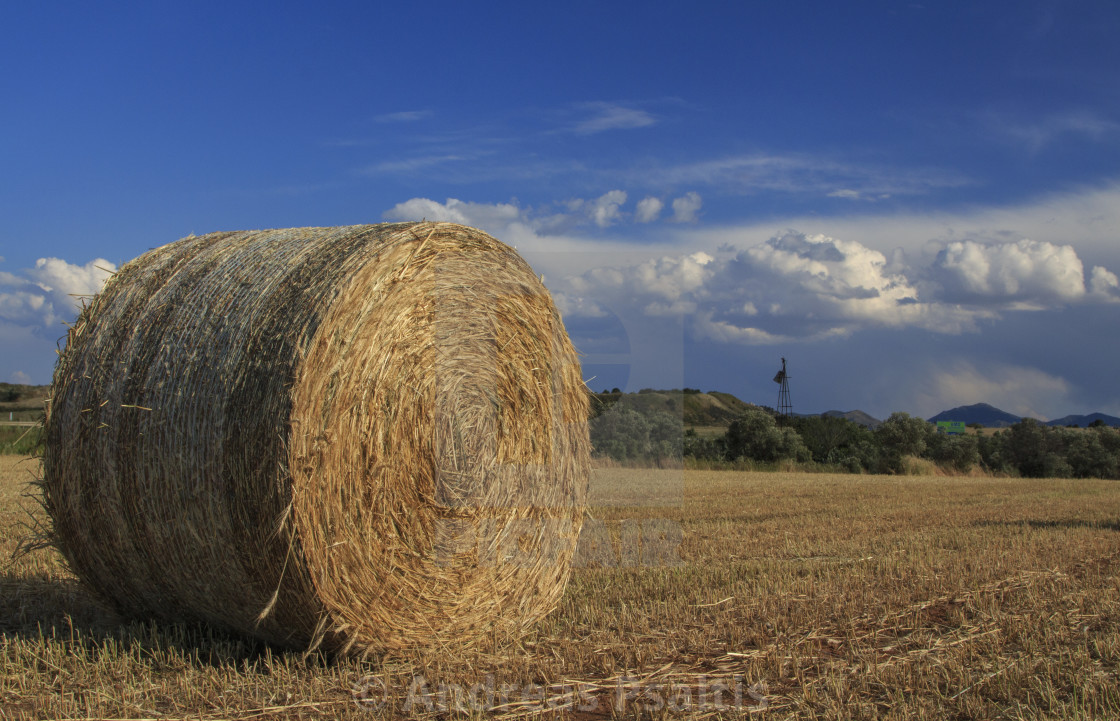 "Hay Bales With Blue Sky And Fluffy Cloud" by Andreas Psaltis - £12.40 "Hay Bales With Blue Sky And Fluffy Cloud" stock image