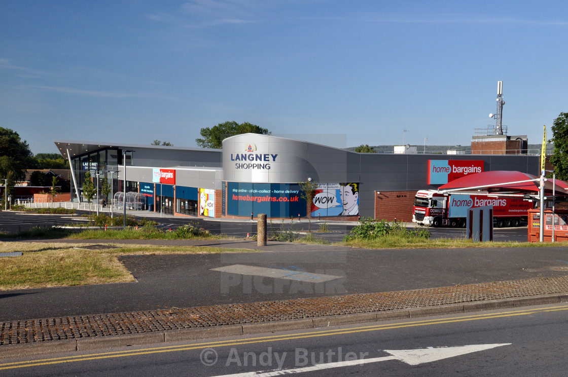 "shopping centre on a sunny morning with Home Bargains delivery truck. Langney Shopping Centre, Eastbourne, England. Early sunny morning with almost empty car park." stock image