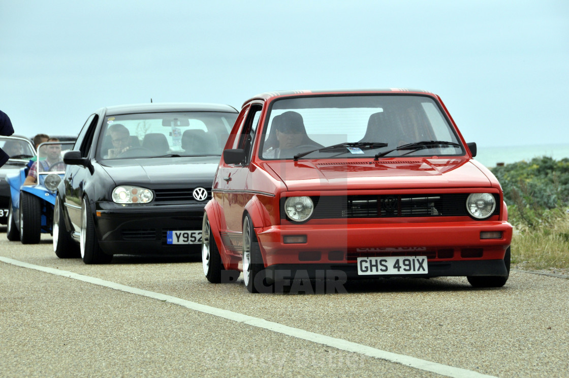 "Red 1982 VW Golf in front of other VW cars at Beach Life Festival. 2017,Eastbourne." stock image