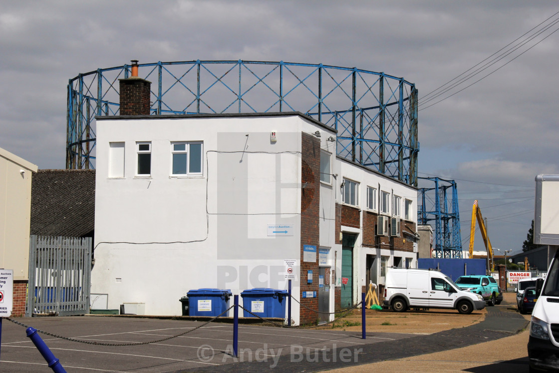 "Small Industrial Estate in Eastbourne with derelict Gas Hokdetrs in the background" stock image