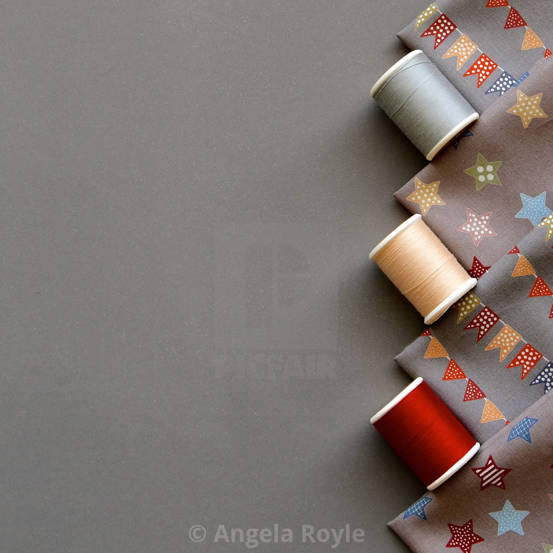 "Flatlay of cotton reels and material" stock image