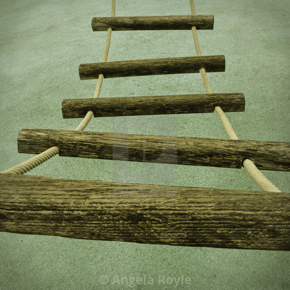 "A rope ladder with wooden rungs" stock image