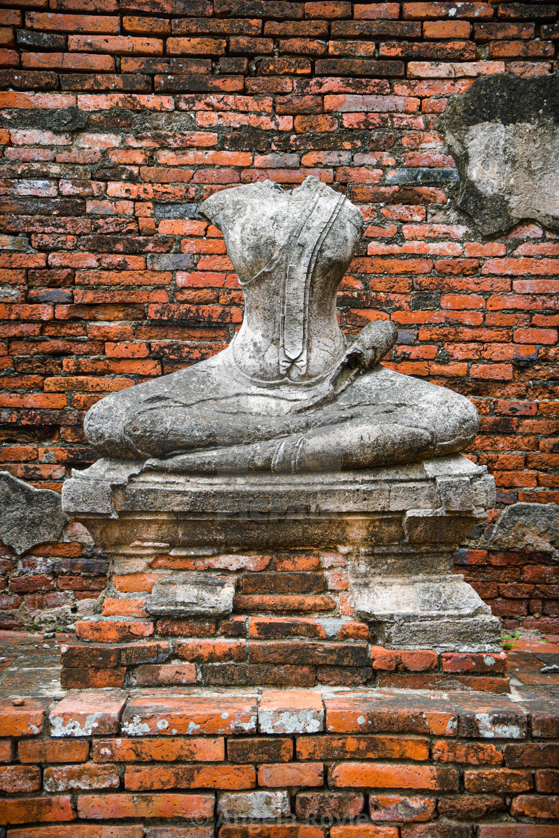"Headless stone Buddha statue" stock image