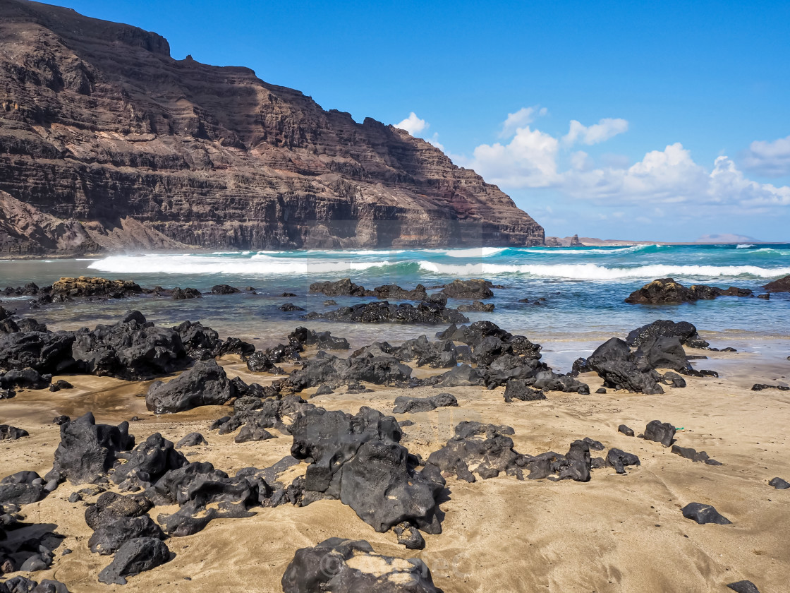 "Lava rocks on the beach at Orzola, Lanzarote, Canary Islands" stock image