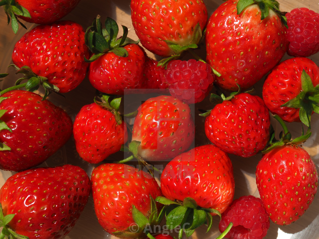 "Bright red strawberries and raspberries" stock image