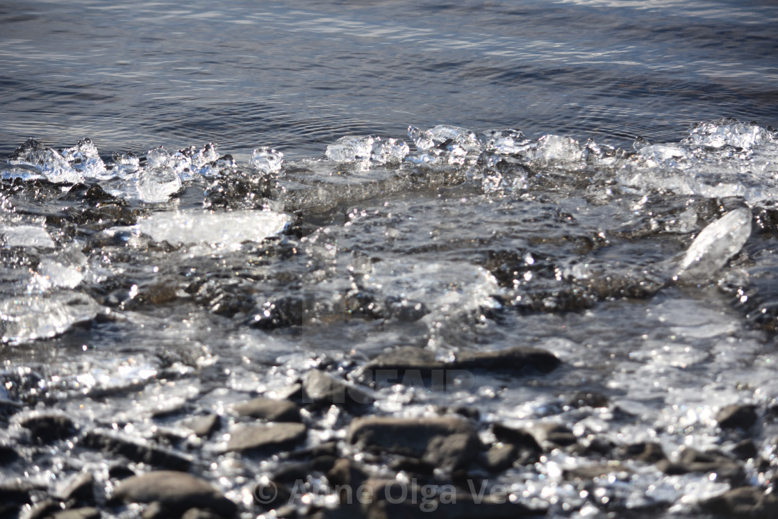 "Clear ice along a beach" stock image