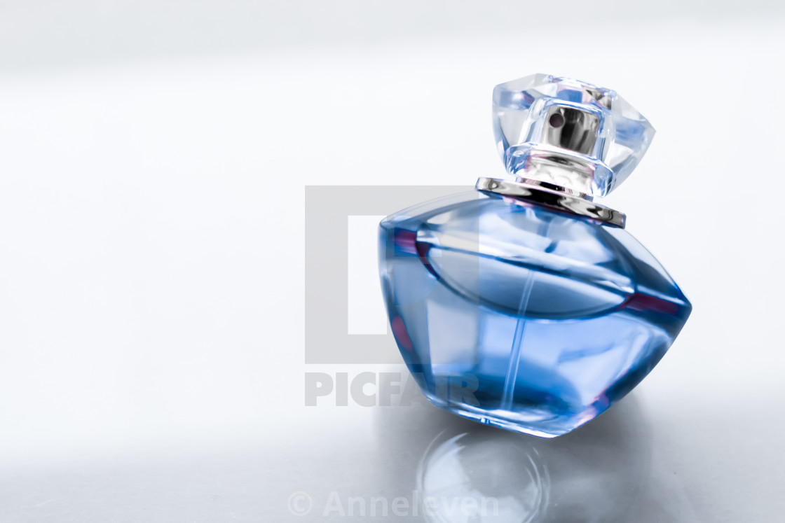 Blue perfume bottle on glossy background, sweet floral scent, glamour... -  License, download or print for £ | Photos | Picfair