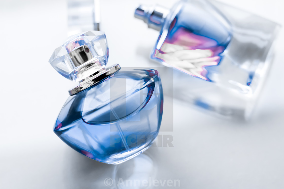 Blue perfume bottle on glossy background, sweet floral scent, glamour... -  License, download or print for £ | Photos | Picfair