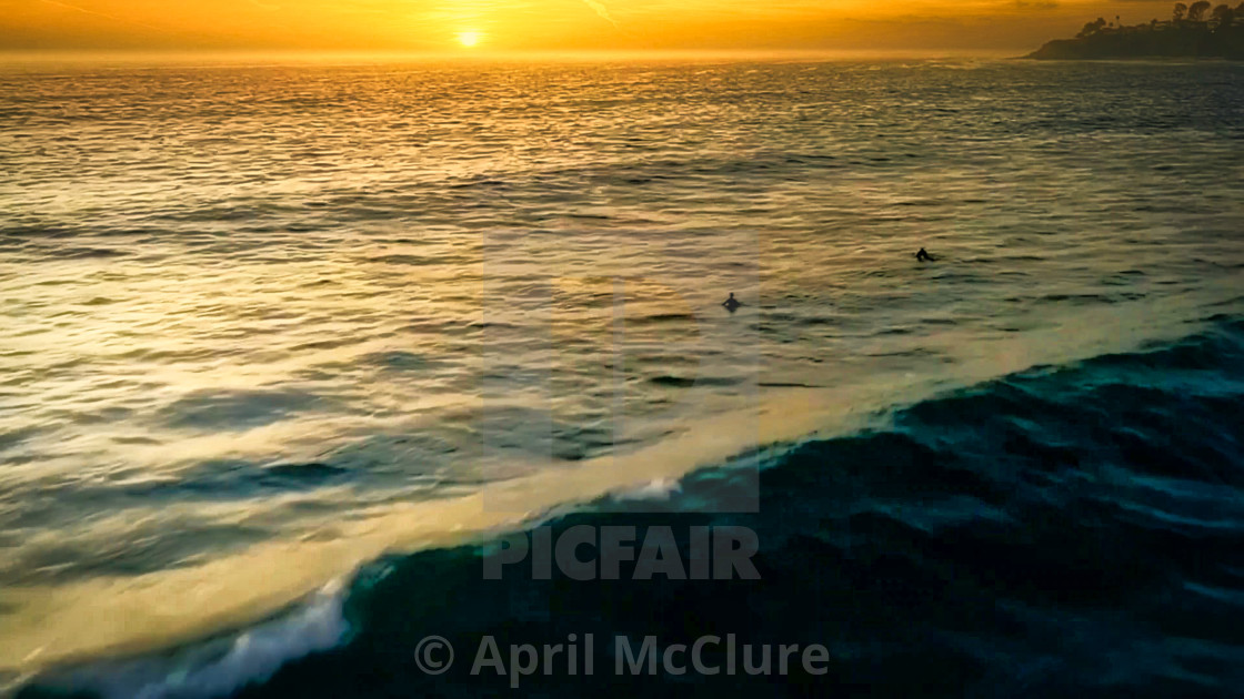 "Surfers at Sunset - Waiting for the next set with wave" stock image