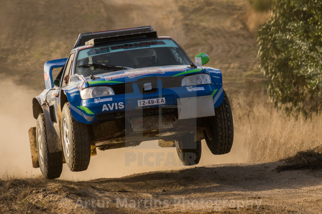"A Seat off-road race car makes a jump on a dirt road" by Artur Martins Photography - £9.49 "A Seat off-road race car makes a jump on a dirt road" stock image