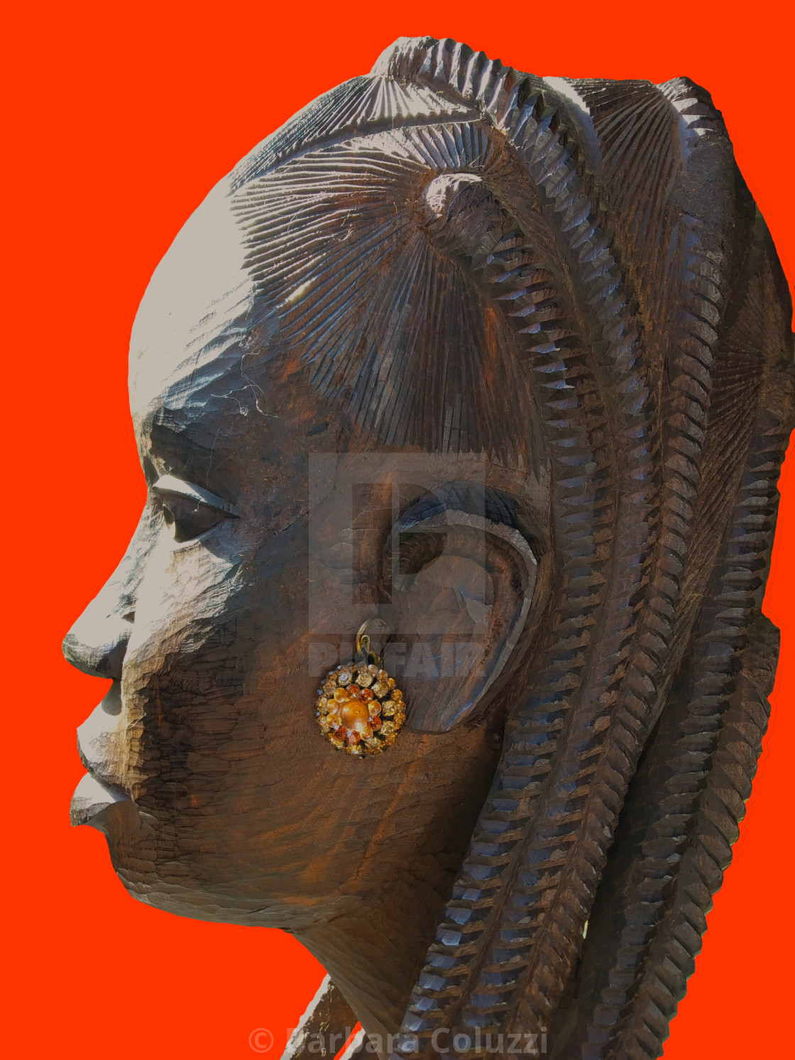 "Feminine African statue on Red Background" stock image