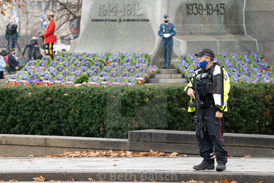 "Policeman Keeps Spectators Away From Remembrance Day Ceremony in Ottawa, Canada." by Beth Baisch - $12.33 "Policeman Keeps Spectators Away From Remembrance Day Ceremony in Ottawa, Canada." stock image